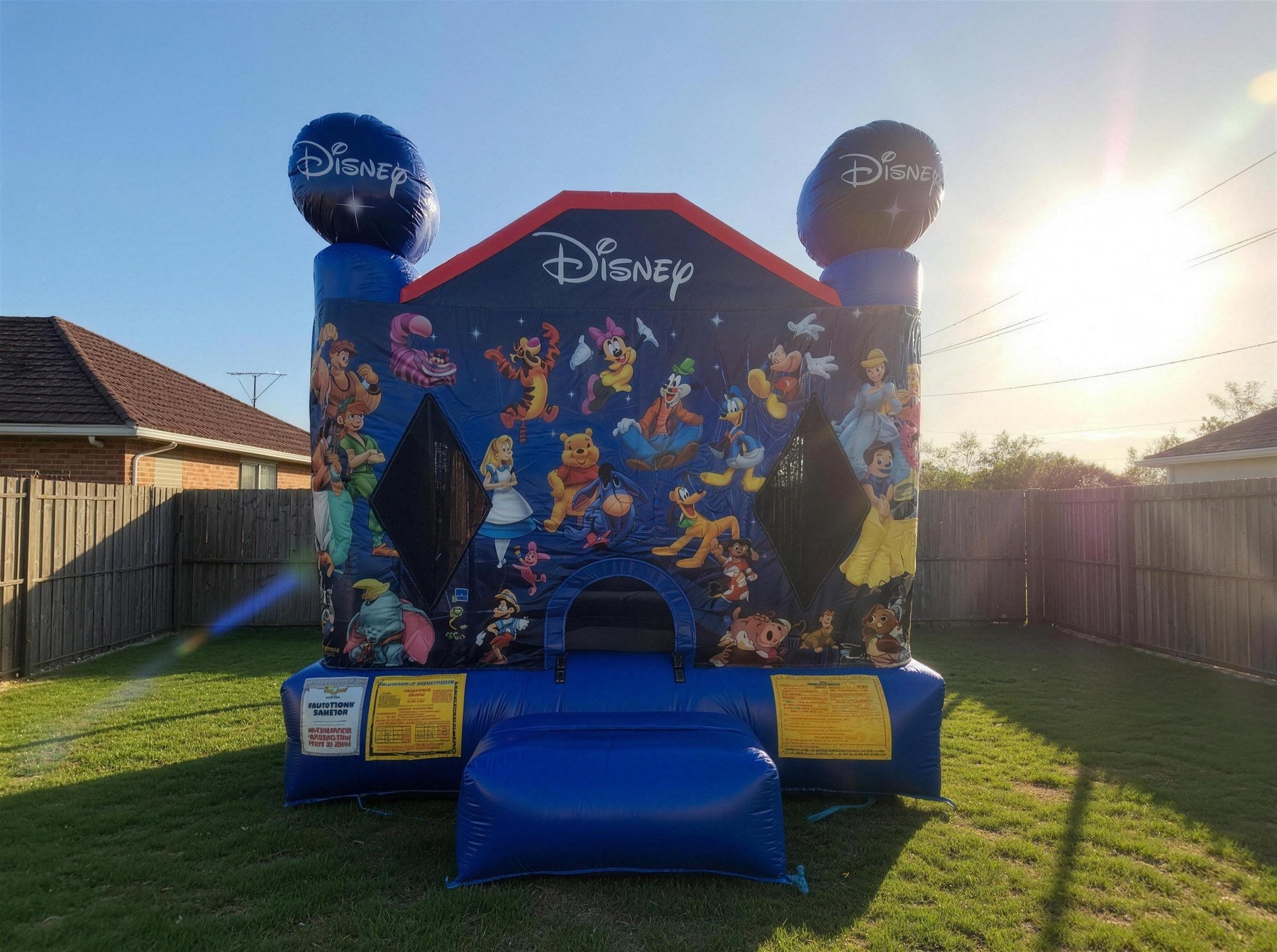 World of Disney jumping castle set up in a Central Coast backyard at golden hour